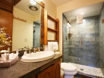 a bathroom with a sink and a toilet at 61 Jabberwocky Home by Stay Winter Park in Fraser
