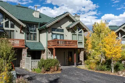 a house with a balcony and a driveway at Timber Lake 341 in Winter Park