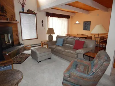 a living room with a couch and a tv at Timber Ridge Building B, Unit 2 in Winter Park