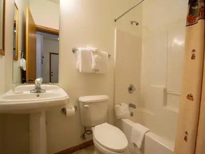 a bathroom with a toilet and a sink and a shower at Winterstar Building G #3 by Stay Winter Park in Fraser