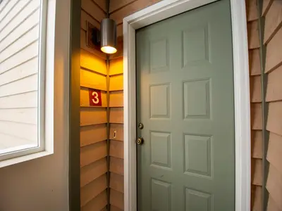 a door to a house with the number eight next to it at Winterstar Building G #3 by Stay Winter Park in Fraser