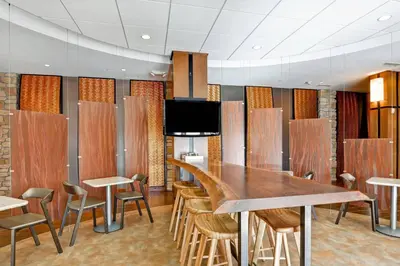 a conference room with a wooden table and chairs at SpringHill Suites Denver at Anschutz Medical Campus in Aurora