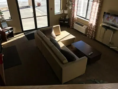 a living room with a couch and a tv at Super 8 by Wyndham Kremmling in Kremmling