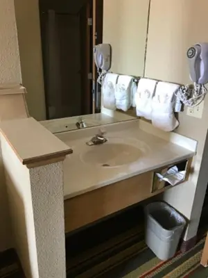 a bathroom with a sink and a mirror at Super 8 by Wyndham Kremmling in Kremmling