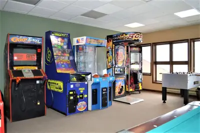 a room with arcade games and video game machines at The Inn at Silvercreek in Granby