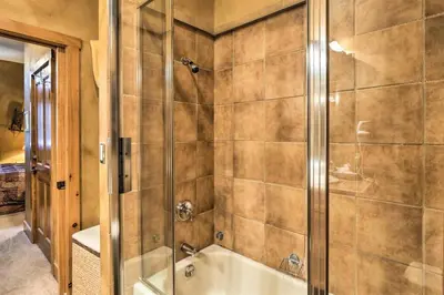 a bathroom with a shower and a bath tub at Ski-In, Ski-Out 1 Bedroom Plus Murphy At The Timbers in Keystone