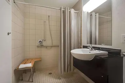 a bathroom with a sink and a shower at Park Inn by Radisson, Lakewood in Lakewood