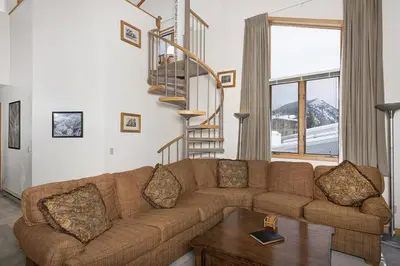 a living room with a couch and a table at Ski Run - Mountain House Keystone in Keystone