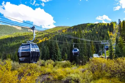 two gondolas on a ski lift in the mountains at Ski Run - Mountain House Keystone in Keystone