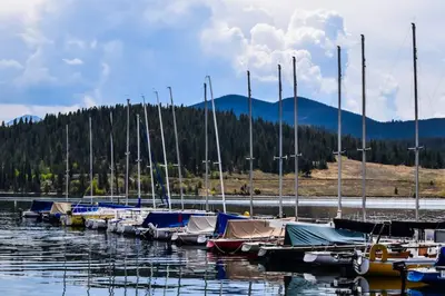 a bunch of boats are docked in the water at Snowdance - Keystone in Dillon