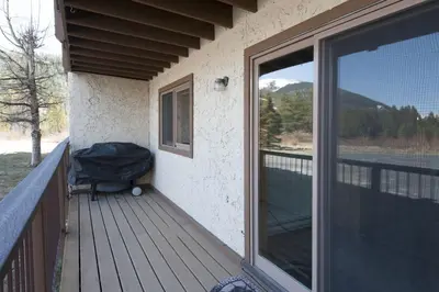 a balcony of a house with a large sliding glass door at Snowdance - Keystone in Dillon