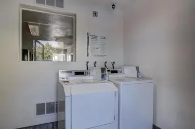 a laundry room with a washer and dryer at Motel 6 Fort Collins, CO in Fort Collins