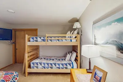 a bedroom with two bunk beds and a table at La Bonte Leisure Beauty in Dillon