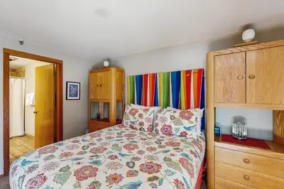 a bedroom with a bed with a colorful bedspread at La Bonte Leisure Beauty in Dillon