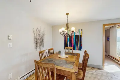 a dining room with a wooden table and chairs at La Bonte Leisure Beauty in Dillon