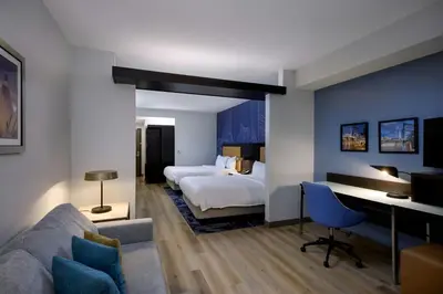 a bedroom with a bed and a desk in a room at Fairfield Inn & Suites by Marriott Denver Downtown in Denver