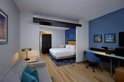 a hotel room with a bed and a desk at Fairfield Inn & Suites by Marriott Denver Downtown in Denver