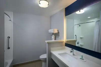a bathroom with a sink and a toilet and a shower at Fairfield Inn & Suites by Marriott Denver Downtown in Denver