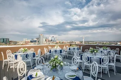 a group of tables and chairs on a balcony at Fairfield Inn & Suites by Marriott Denver Downtown in Denver