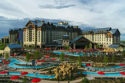 a resort with several pools and umbrellas at Gaylord Rockies Resort & Convention Center in Aurora