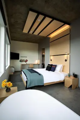 a bedroom with a large bed in a room at The Source Hotel in Denver