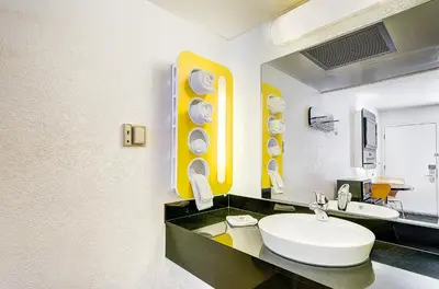a bathroom with a sink and a mirror at Motel 6 Thornton in Thornton