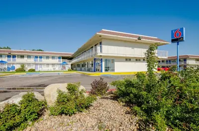 a building with a no parking sign in a parking lot at Motel 6 Thornton in Thornton