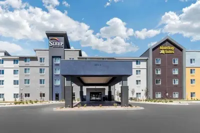 a rendering of a hotel with a large building at Sleep Inn & Suites Denver International Airport in Denver