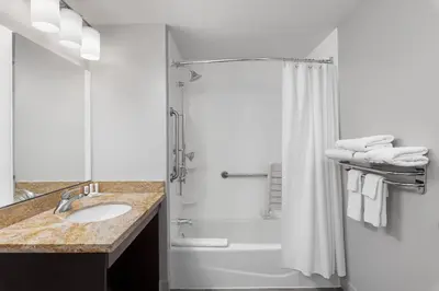 a bathroom with a shower and a sink at TownPlaces Suite Denver Airport at Gateway Park in Denver