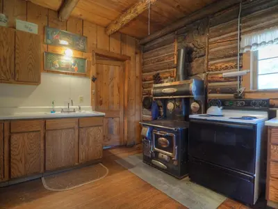 a kitchen with an old stove and a sink at MacCracken Homestead in Estes Park