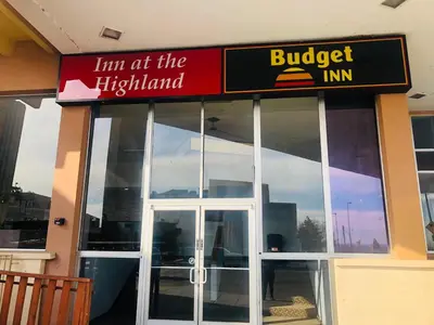 a building with a sign that reads lim at the highest istg at Budget Inn Denver Downtown in Denver