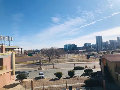 a view of a parking lot with a city at Budget Inn Denver Downtown in Denver