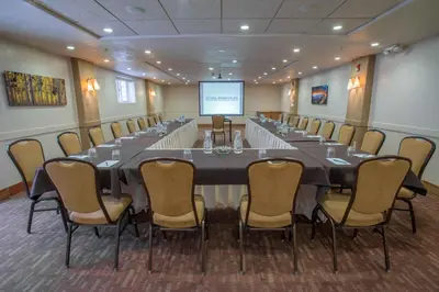 a large conference room with a long table and chairs at Table Mountain Inn in Golden