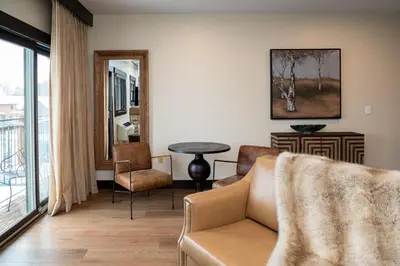 a living room with a couch and chairs and a table at The Estes Park Resort in Estes Park