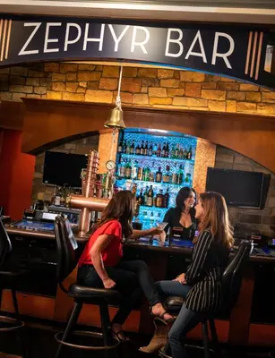 a group of women sitting at a bar at Lady Luck Casino Black Hawk in Black Hawk
