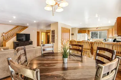 a dining room and kitchen with a table and chairs at Twenty Grand Chalet in Silverthorne