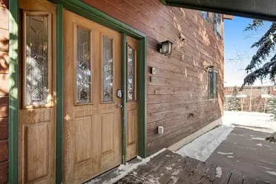 a wooden door on the side of a building at Twenty Grand Chalet in Silverthorne