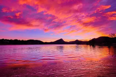 a sunset over a large body of water at Blue Jay Bungalow in Estes Park