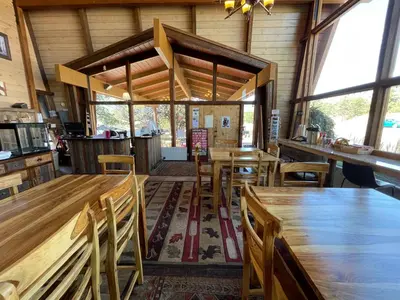 a dining room with wooden tables and chairs at Hotel Estes in Estes Park