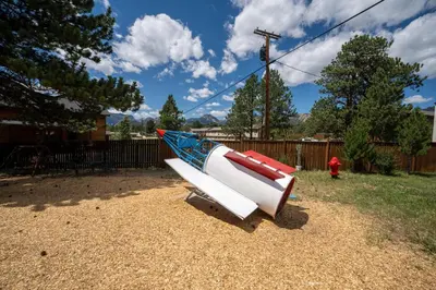 a boat sitting on the ground next to a fire hydrant at Hotel Estes in Estes Park