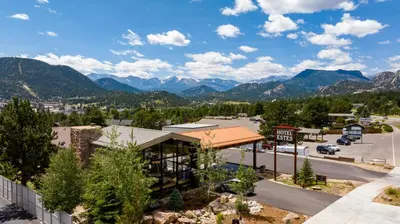 a view of a resort with mountains in the background at Hotel Estes in Estes Park