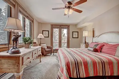 a bedroom with a bed and a ceiling fan at 3069 Timbers Condo in Keystone