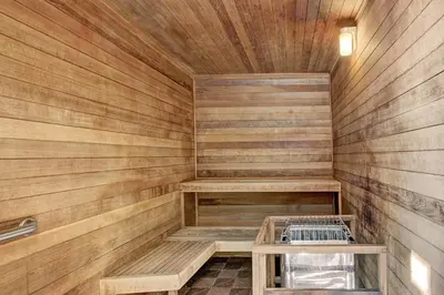 a sauna with wooden walls and benches in a room at 3069 Timbers Condo in Keystone