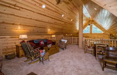 a living room in a log cabin at Armstrong Home in Estes Park