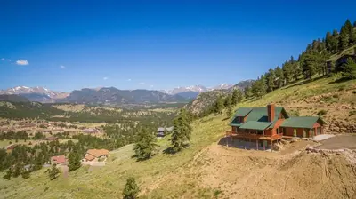 an aerial view of a house on top of a hill at Armstrong Home in Estes Park