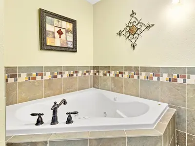 a white bath tub in a bathroom at Divine Condominium 3 Bedroom condo in Estes Park
