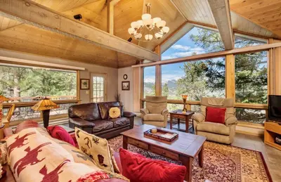 a living room with a couch and a table at Jordan Condominium 3 Bedroom condo in Estes Park