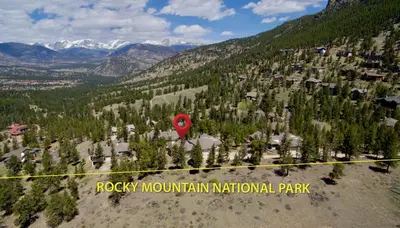 a red stop sign in the middle of a mountain at Jordan Condominium 3 Bedroom condo in Estes Park