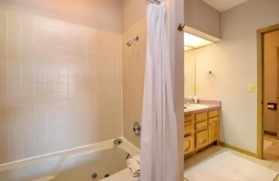 a bathroom with a tub and a sink at Jordan Condominium 3 Bedroom condo in Estes Park