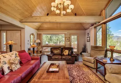 a living room with a couch and a table at Jordan Condominium 3 Bedroom condo in Estes Park